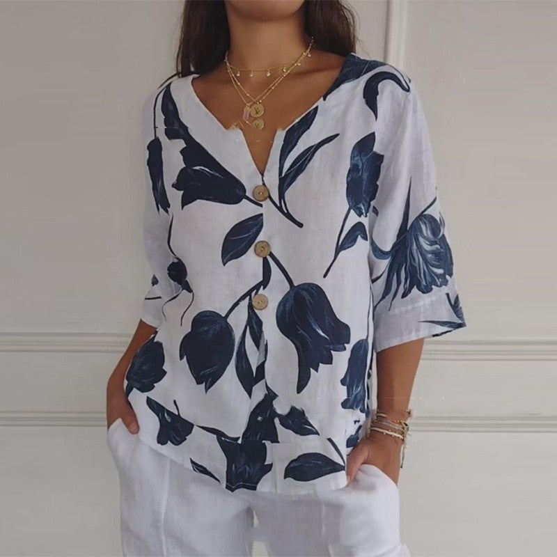 White summer button-up shirt with navy floral leaf print and V-neck, 3/4 sleeves