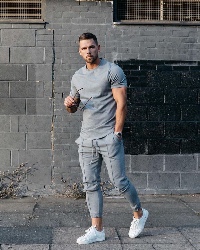 Light gray cotton t-shirt with black chest graphic and light gray drawstring jogger pants