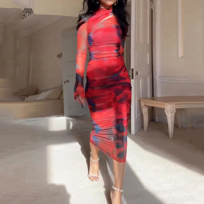 Red, pink and blue abstract midi sheath dress with long sleeves and high neckline