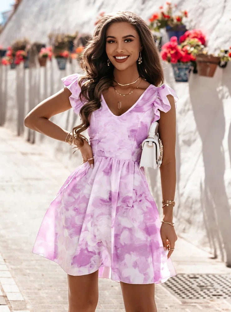 Purple one-shoulder mini dress with ruffled sleeve and gathered waist