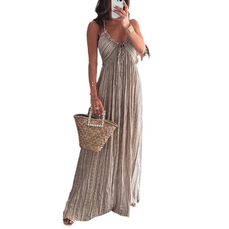 Dark striped maxi dress with thin spaghetti straps and tassel neckline