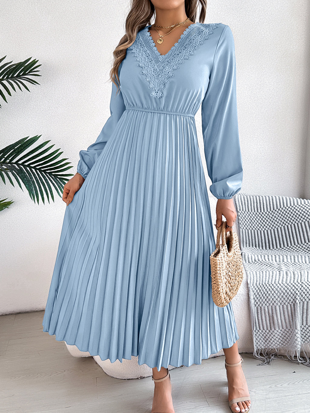 Light blue pleated midi dress with V-neck lace trim, long sleeves, gathered waist