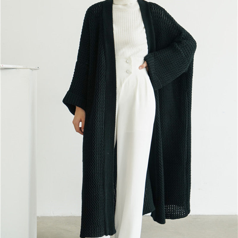 Black textured knit cardigan with open front and long sleeves