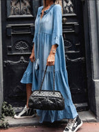 Light blue tiered maxi dress with V-neck, front buttons, relaxed fit and long tiered skirt