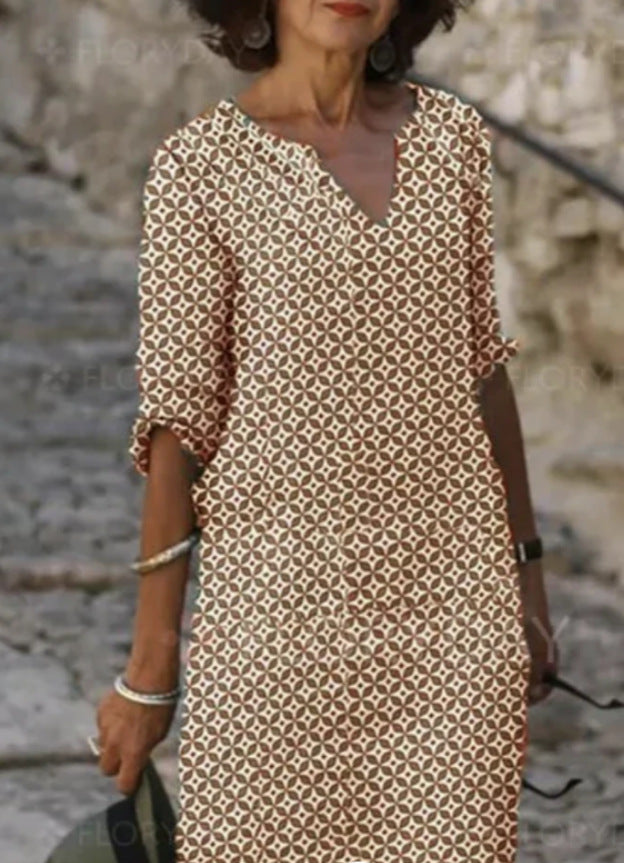 Brown patterned V-neck shift dress with long sleeves, above-knee length