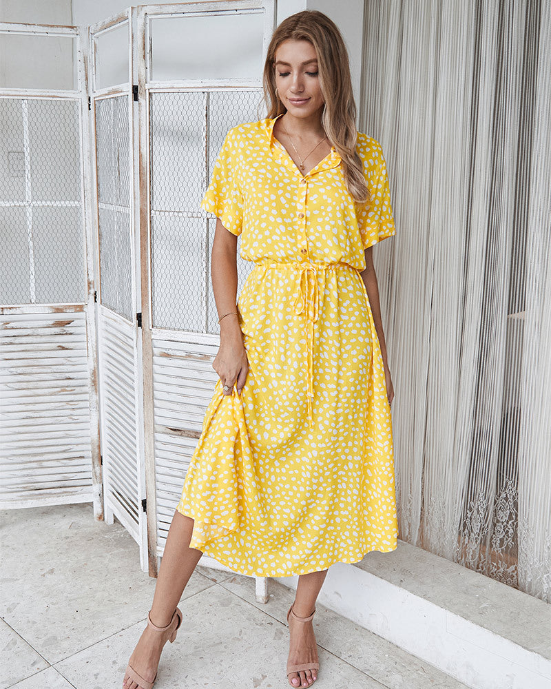 Yellow printed V-neck midi dress with short sleeves and cinched waist