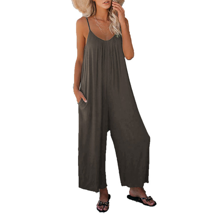 Gray loose-fitting jumpsuit with thin straps and wide, relaxed legs.
