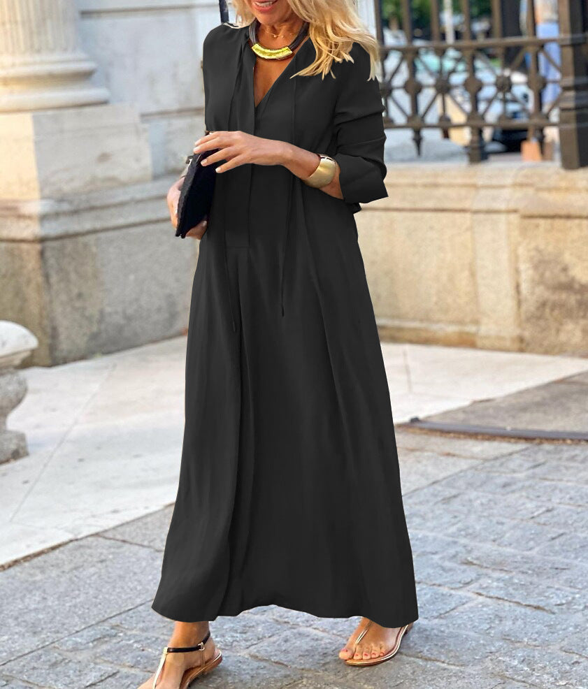 Black long-sleeve V-neck maxi dress with relaxed fit and button-front styling