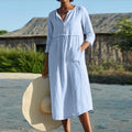 Light blue button-front summer dress with V-neck and three-quarter sleeves