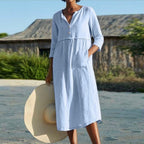 Light blue button-front summer dress with V-neck and three-quarter sleeves