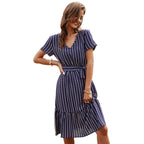 Navy blue striped midi dress with tiered skirt, short sleeves, and waist tie