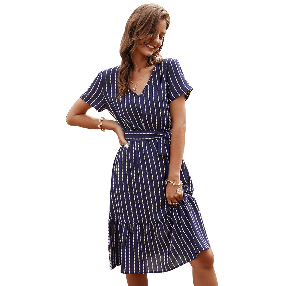 Navy blue striped midi dress with tiered skirt, short sleeves, and waist tie