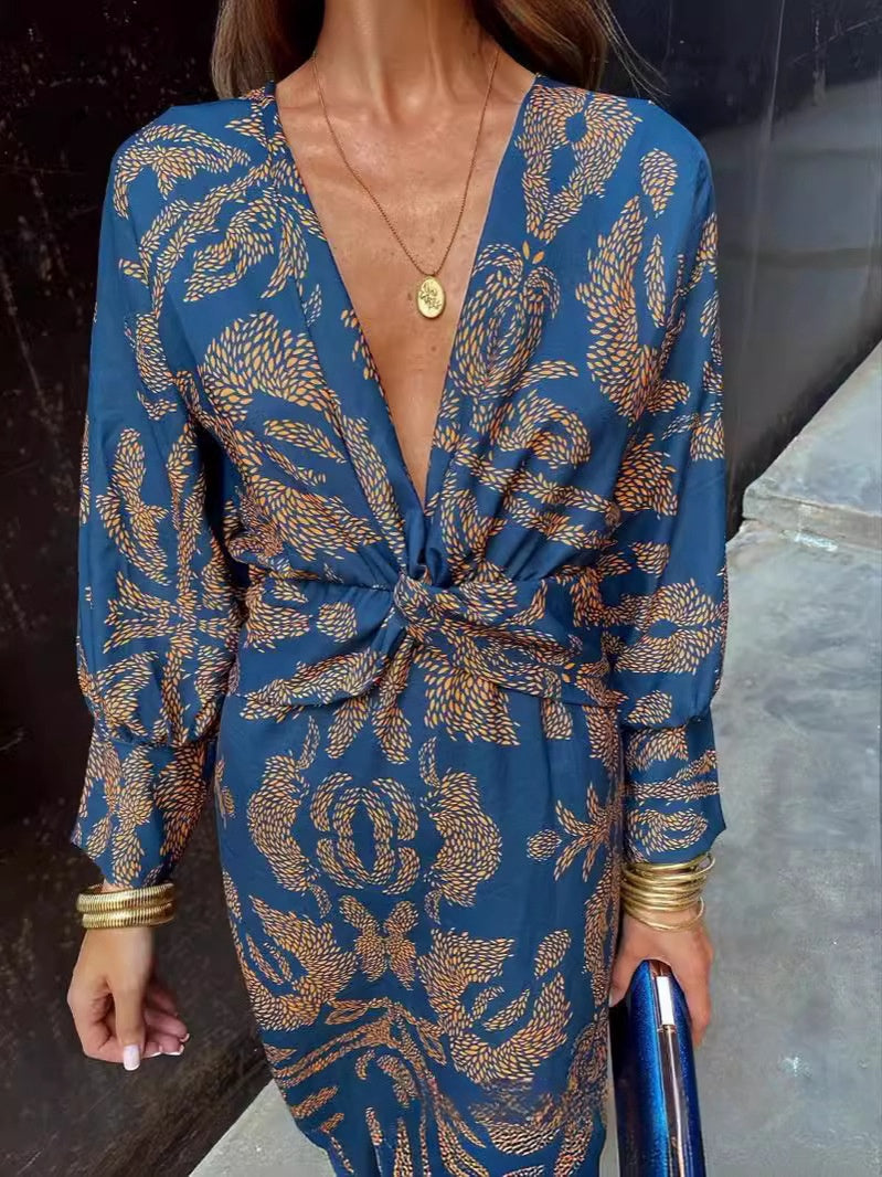 Blue patterned summer dress with V-neck wrap and knotted waist tie, long sleeves