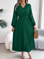 Green pleated midi dress with V-neck lace trim and long balloon sleeves