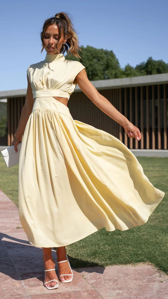 Cream sleeveless midi dress with high neck, fitted bodice, and full pleated skirt