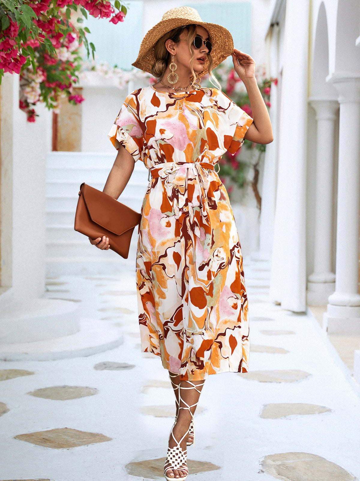 Orange and white abstract print maxi dress with short sleeves and tied waist