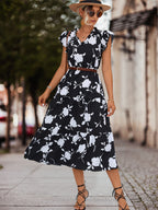 Black floral tiered midi dress with V-neck, cap sleeves and waist belt