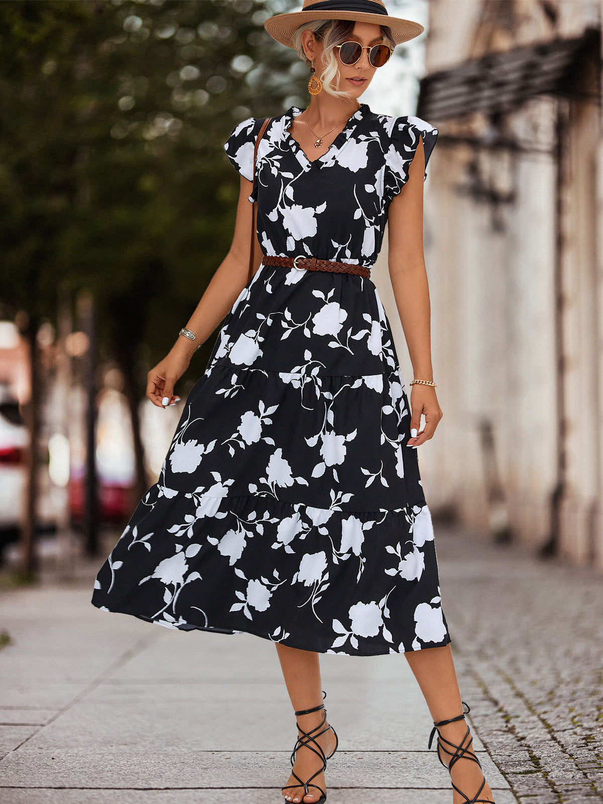 Black floral tiered midi dress with V-neck, cap sleeves and waist belt