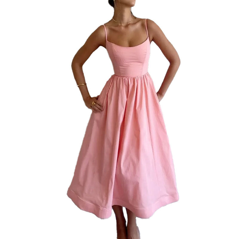 Pink sleeveless maxi dress with spaghetti straps and gathered waist full skirt