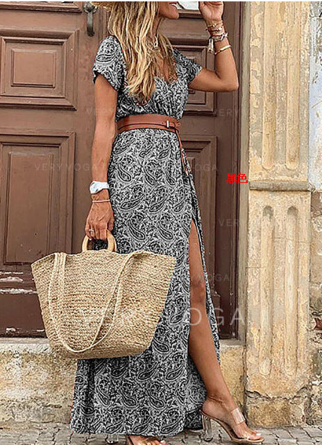 Boho maxi dress in black and white paisley print with short sleeves and side slit