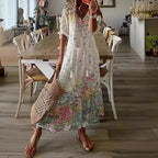 White boho maxi dress with multicolor scattered floral print and tiered skirt