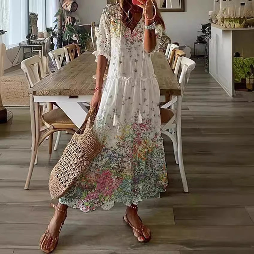 White boho maxi dress with multicolor scattered floral print and tiered skirt
