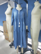 Light blue loose maxi dress on mannequins, V-neck with tassel tie and three-quarter sleeves