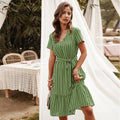 Green striped midi dress with V-neck, short sleeves, and waist tie