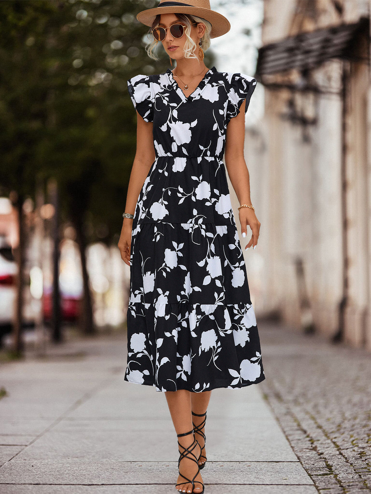 Black floral tiered midi dress with V-neck, cap sleeves and braided waist belt