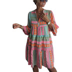 Women's patchwork summer dress in pink and teal with V-neck, long sleeves, tiered skirt