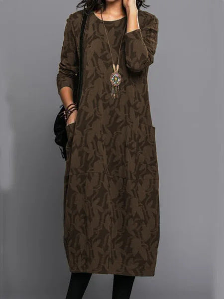 Stylish long dark brown dress with abstract foliage pattern, long sleeves, round neckline