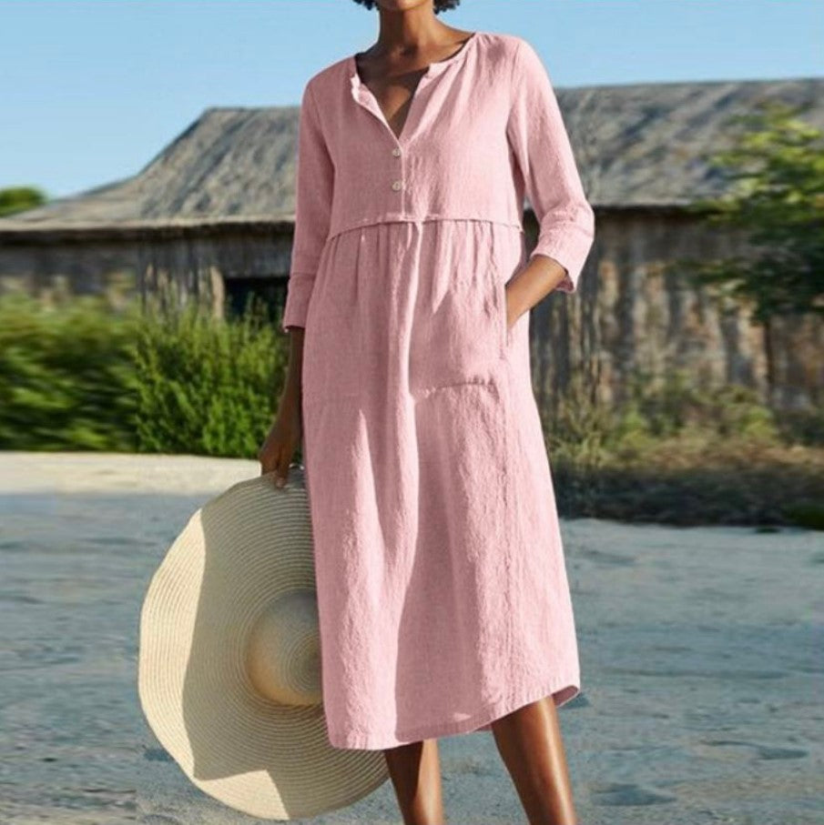 Light pink button-front summer dress with V-neck and three-quarter sleeves
