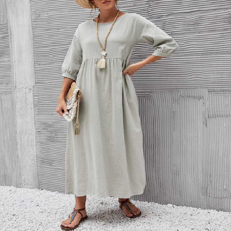 Light gray long maxi dress with gathered neckline and three-quarter sleeves