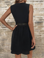 OTA elegant mini dress in black, sleeveless with lace trim at waist
