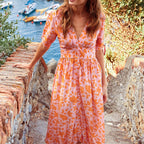 Orange leaf-print midi dress with V-neck button front and gathered skirt, tie cuffs