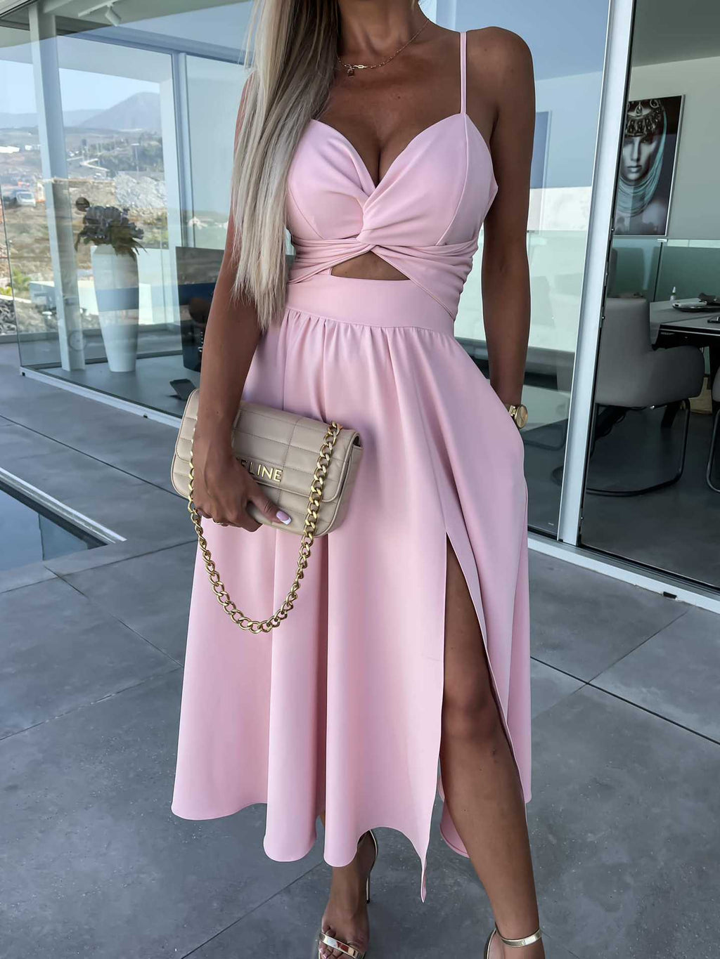 Stylish light pink midi dress with spaghetti straps, V-neck, knot waist, and side slit