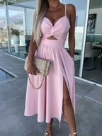 Stylish light pink midi dress with spaghetti straps, V-neck, knot waist, and side slit