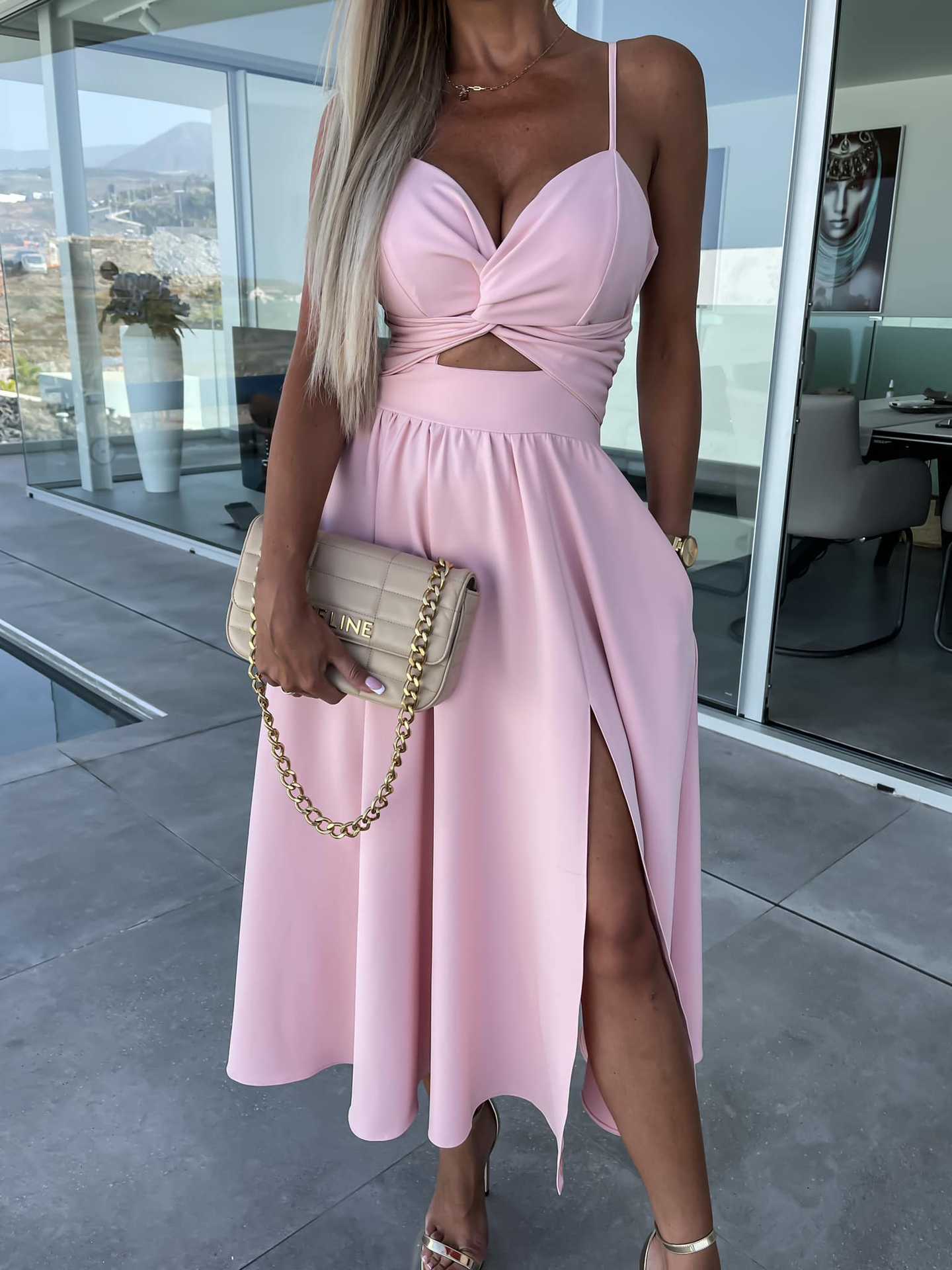 Stylish light pink midi dress with spaghetti straps, V-neck, knot waist, and side slit