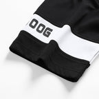 Black shorts hem with white logo patch and contrast inner waistband trim