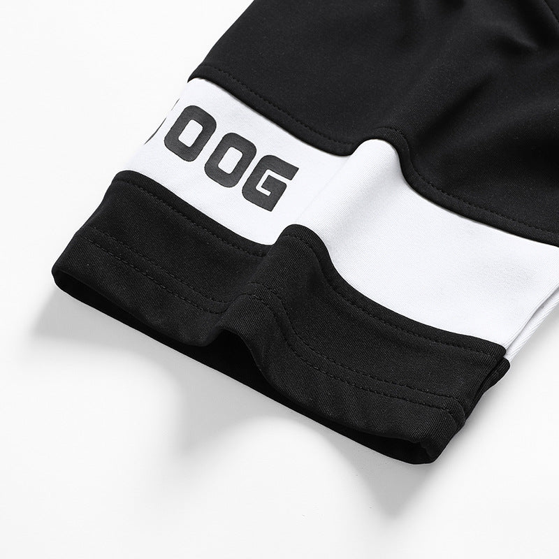 Black shorts hem with white logo patch and contrast inner waistband trim