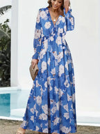 Blue floral maxi dress with V-neck and long sleeves, tiered skirt