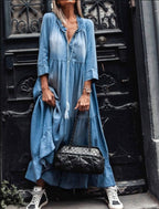 Light blue tiered maxi dress with V-neck, front buttons, three-quarter sleeves