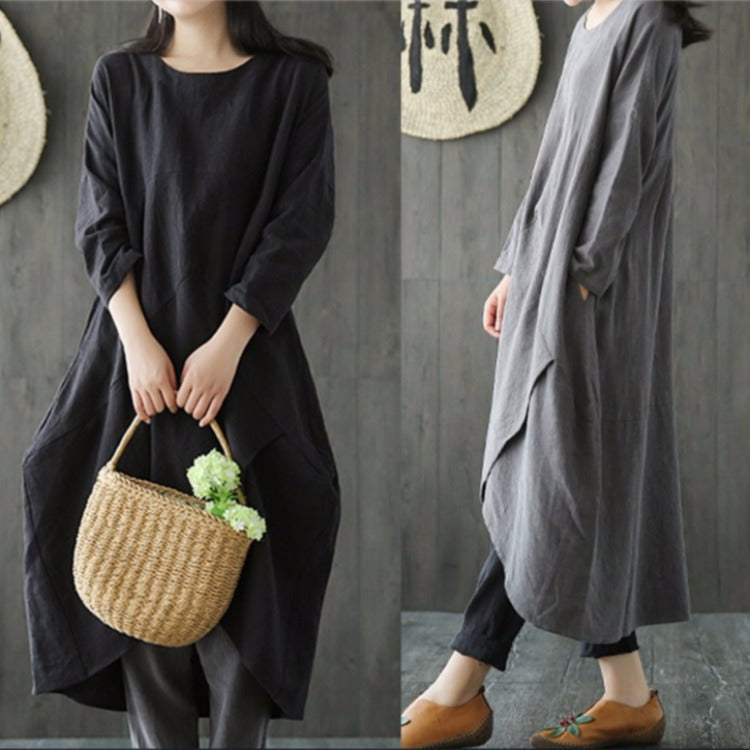Black oversized spring dress with 3/4 sleeves, round neck, asymmetrical draped hem