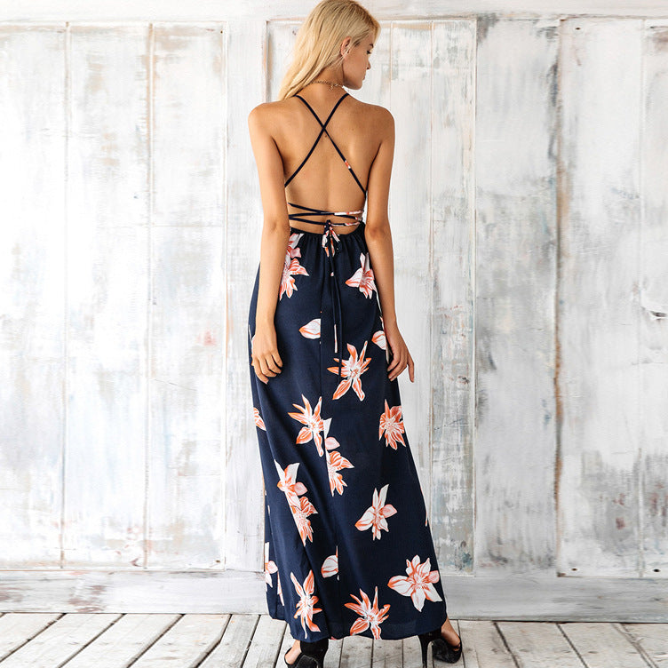 Navy halter maxi dress with crisscross open back and floral skirt