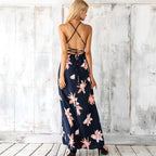 Navy halter maxi dress with crisscross open back and floral skirt