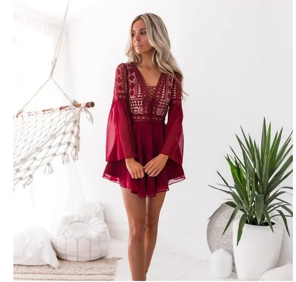 Red mini dress with long sheer sleeves, embroidered V-neck and flared tiered hem
