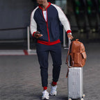 Men's DOLRIX track suit: navy zip jacket with white sleeves and red trim, joggers