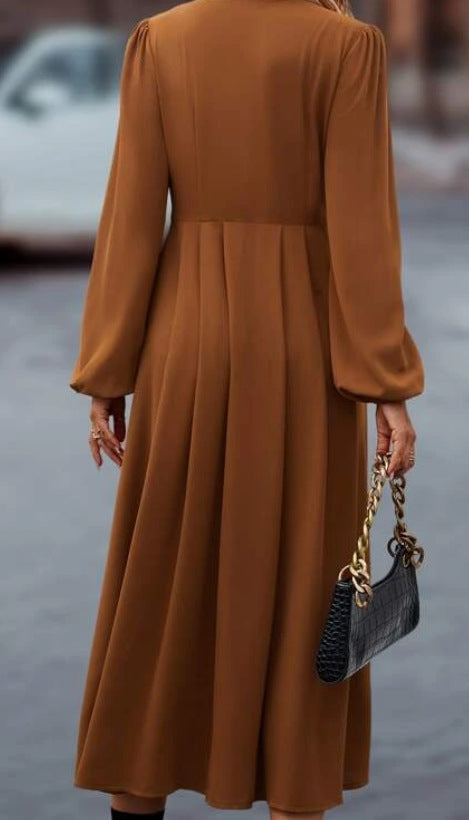 Brown midi dress back view with pleated skirt and long sleeves