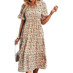 Floral V-neck midi dress in apricot with short puff sleeves and gathered waist