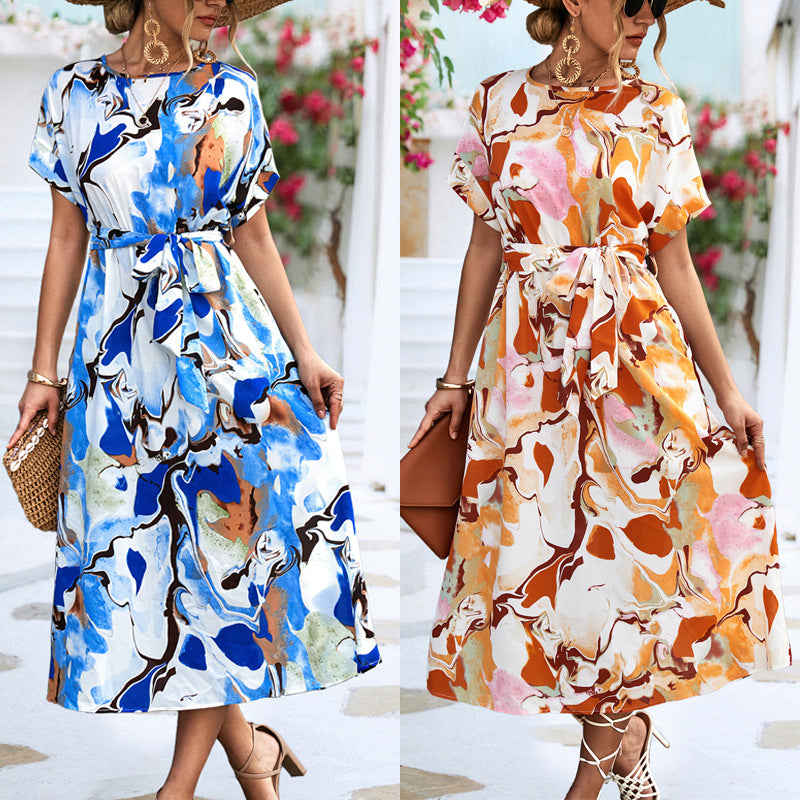Blue and white abstract print maxi dress with short sleeves and tied waist